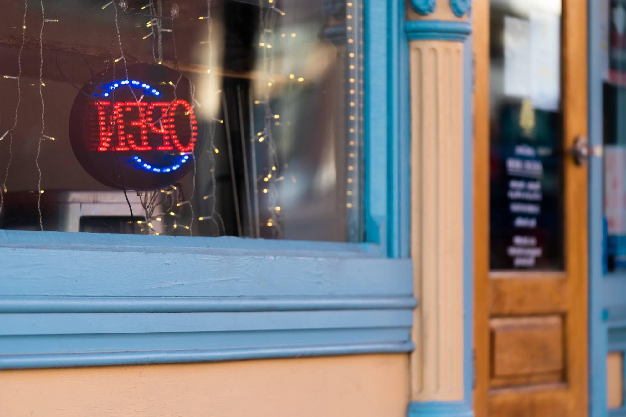 Local storefront with open sign